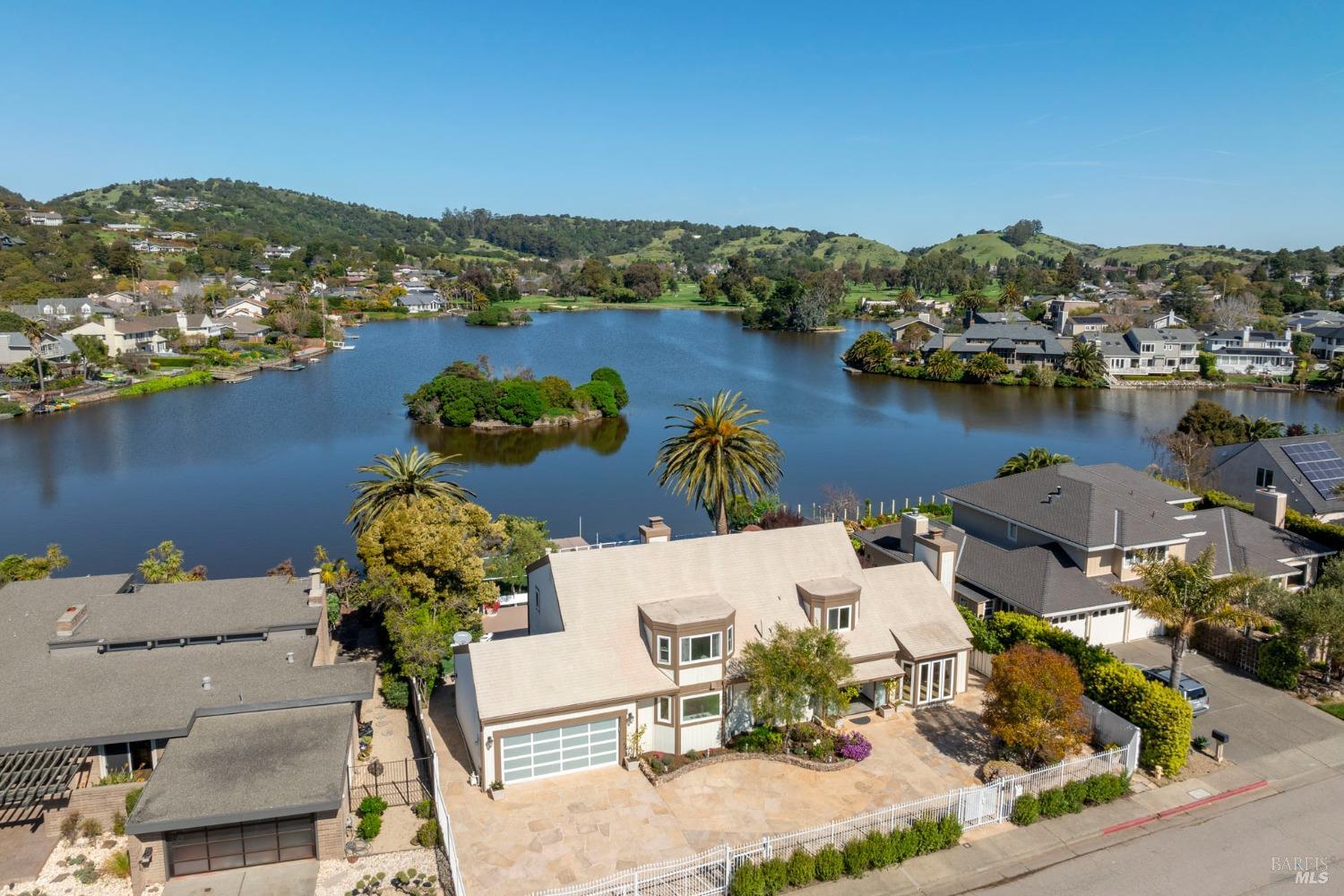 an aerial view of a house with a lake view