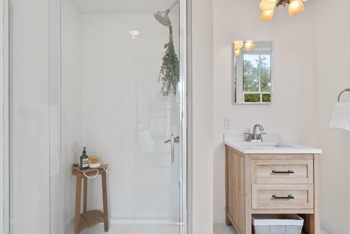 2900 South Main Street Soquel, CA 95073 - Photo 15 of 41 a bathroom with a shower a mirror and a sink