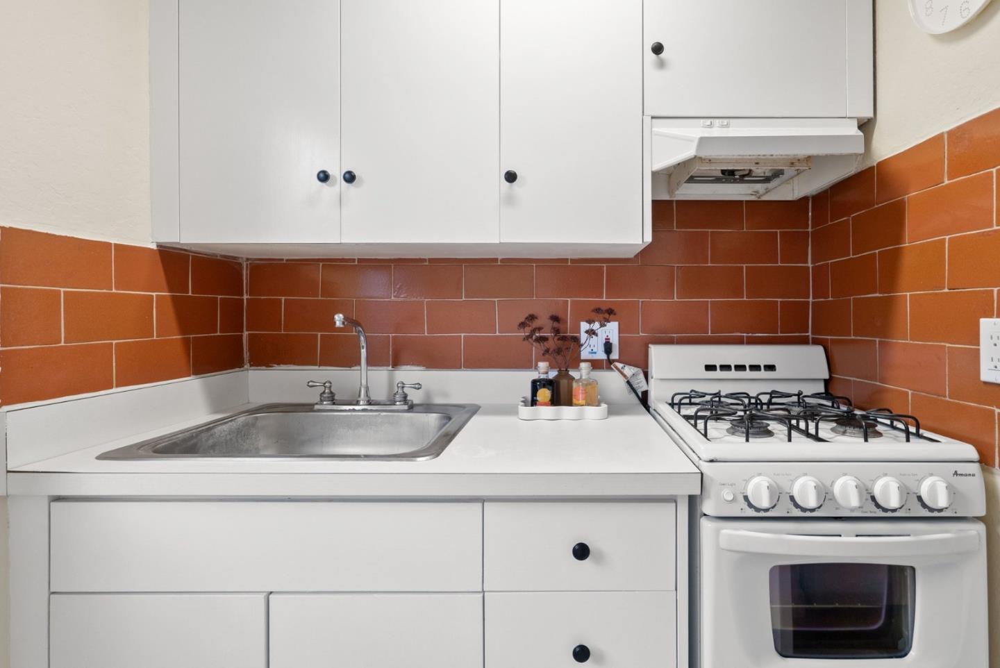 2900 South Main Street Soquel, CA 95073 - Photo 27 of 41 a white stove top oven sitting inside of a kitchen