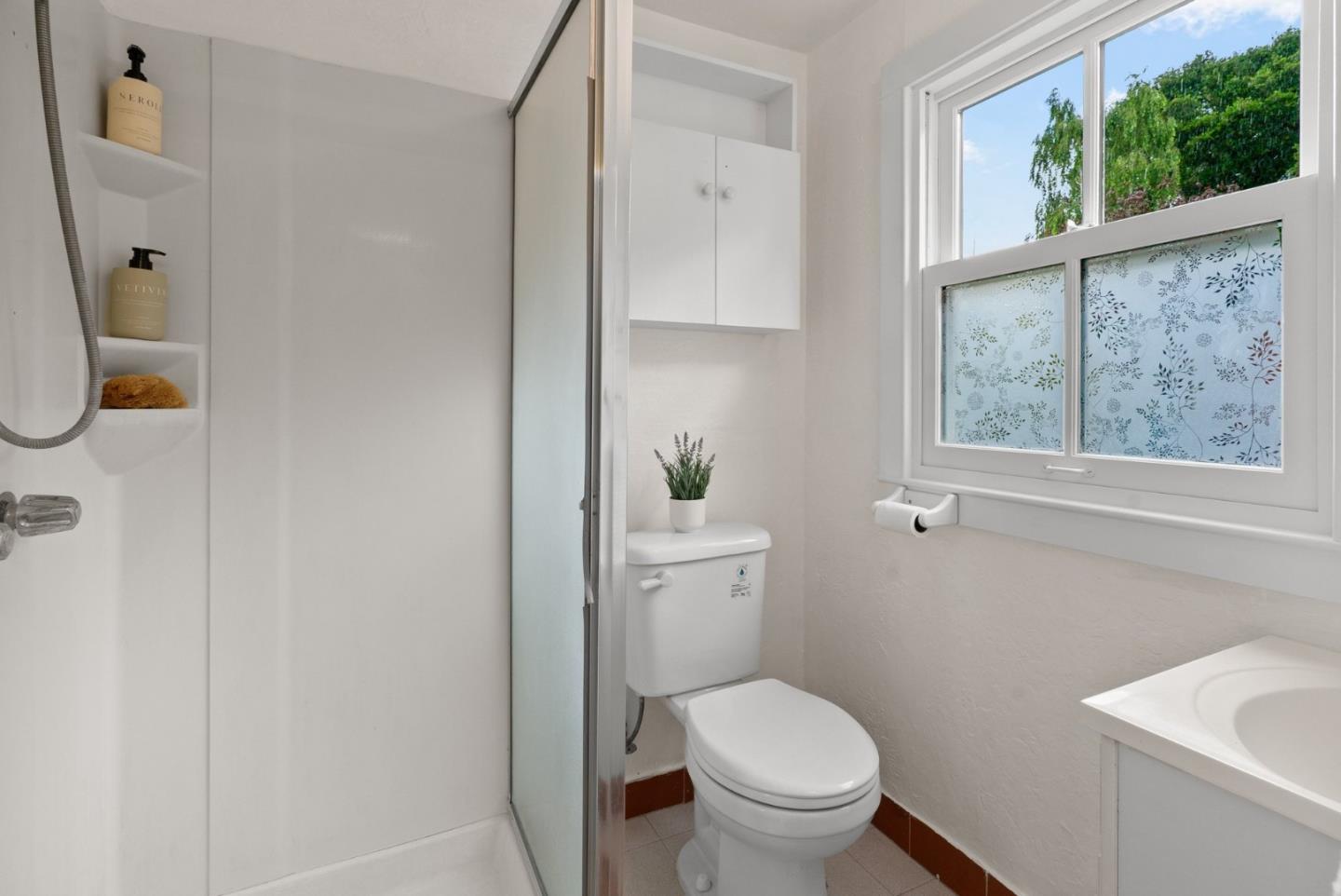 2900 South Main Street Soquel, CA 95073 - Photo 28 of 41 a white toilet sitting next to a bathroom sink