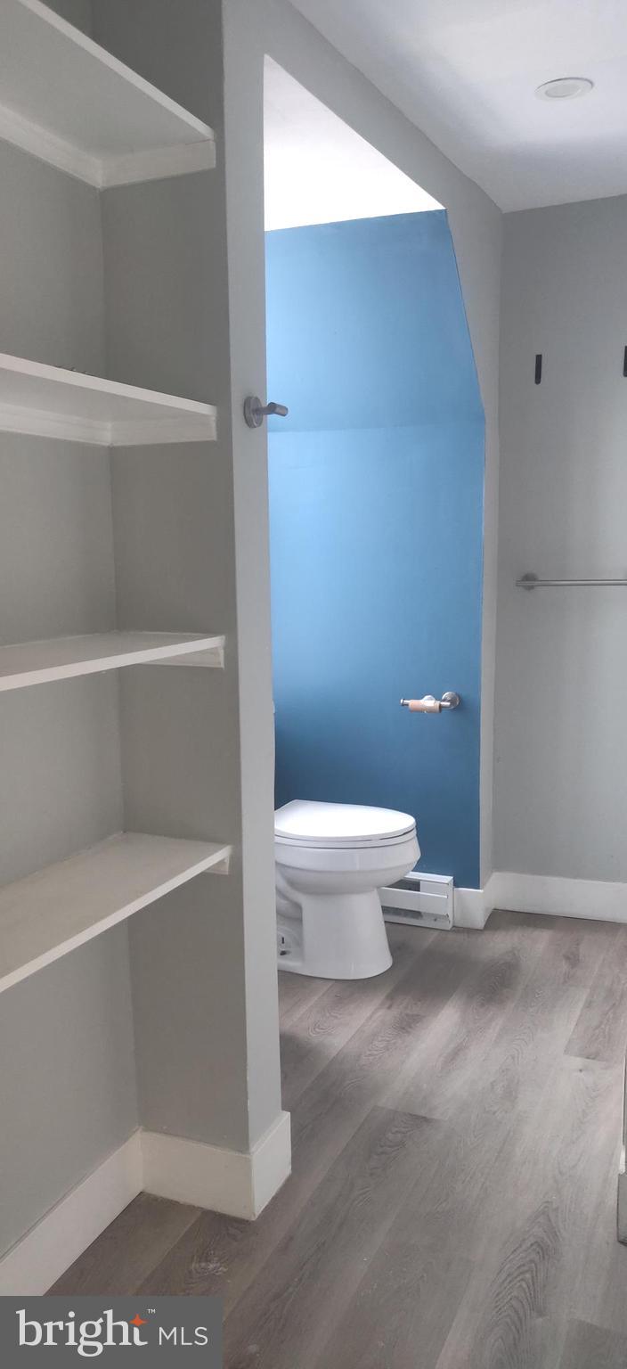 4951 West Thompson Street, Unit 2R Philadelphia, PA 19131 - Photo 6 of 10 a bathroom with a toilet and a shower