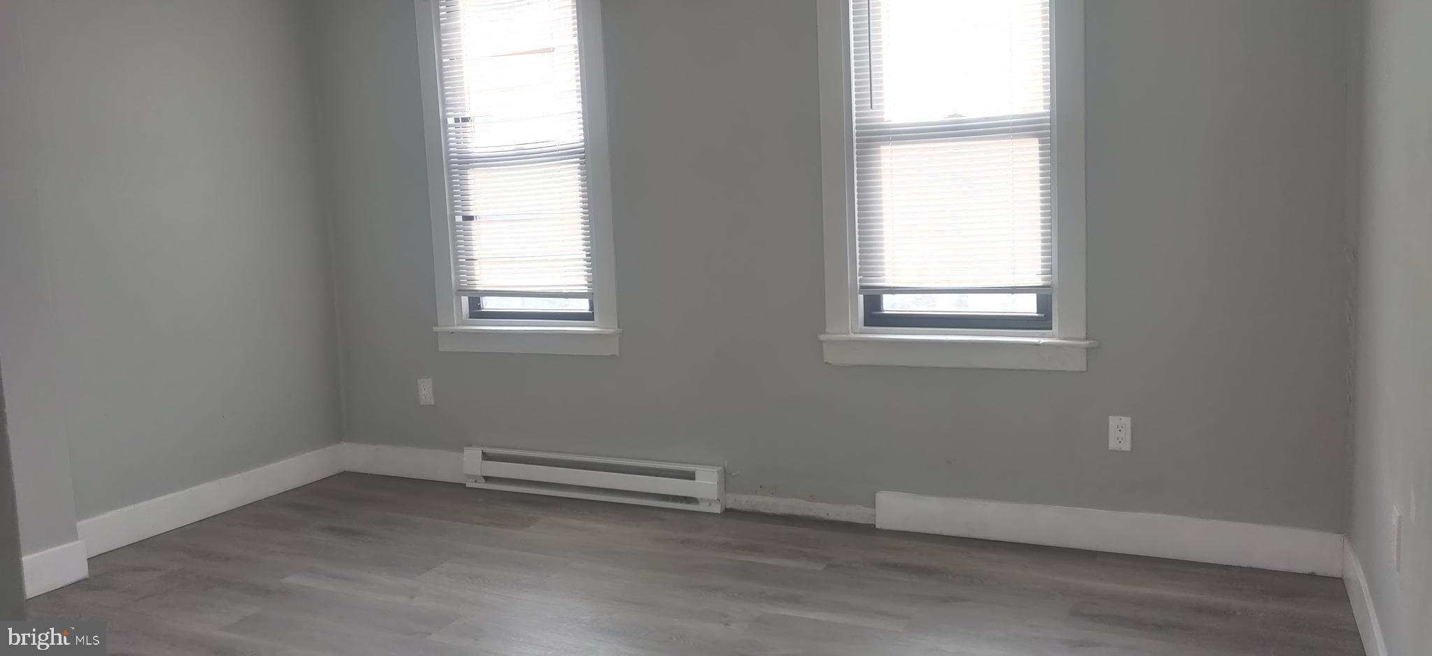 4951 West Thompson Street, Unit 2R Philadelphia, PA 19131 - Photo 8 of 10 an empty room with a window