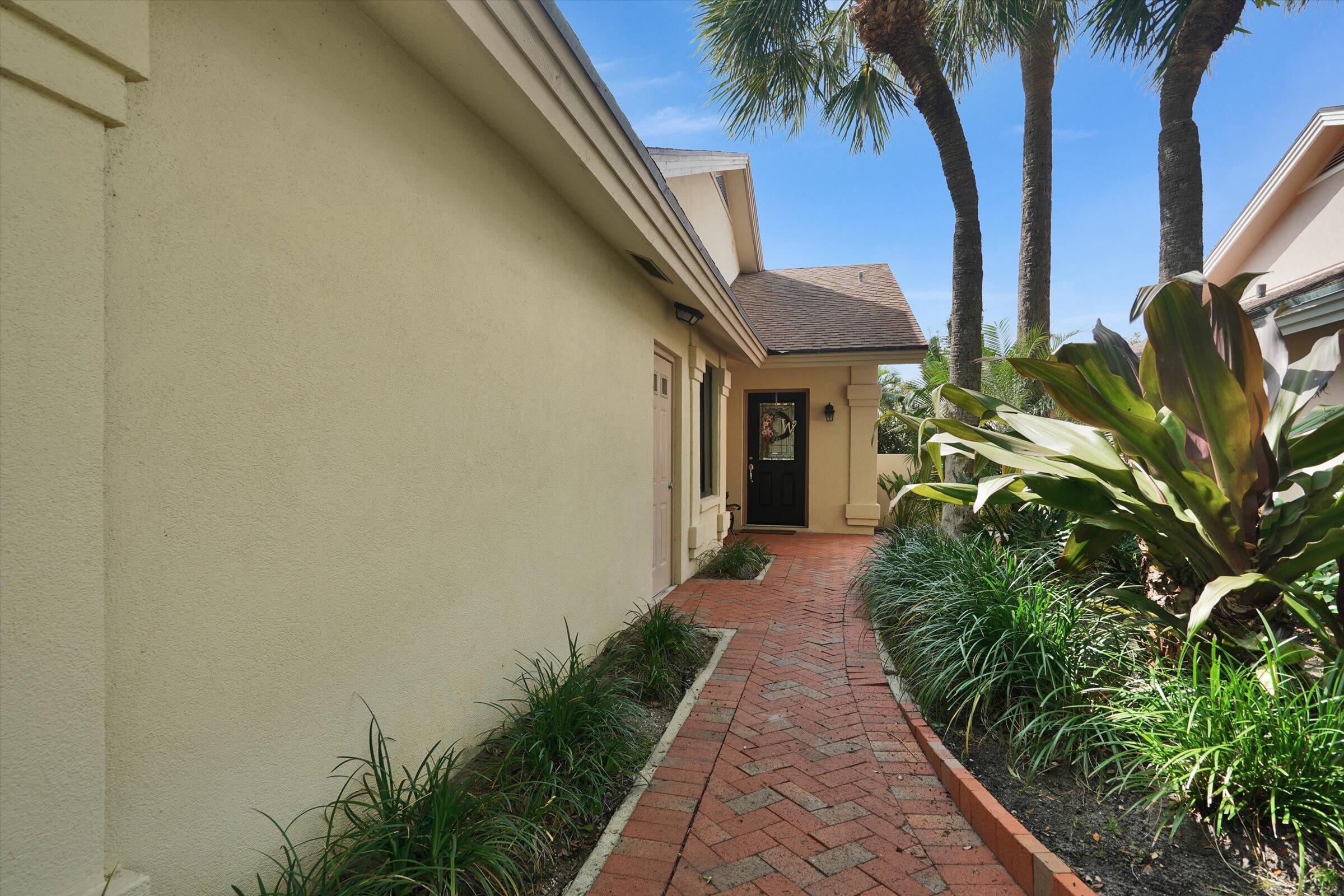 316 River Edge Road Jupiter, FL 33477 - Photo 21 of 53 Brick Walkway to Front Door