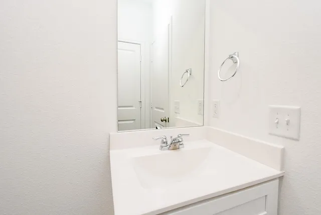 a utility room with cabinets washer and dryer