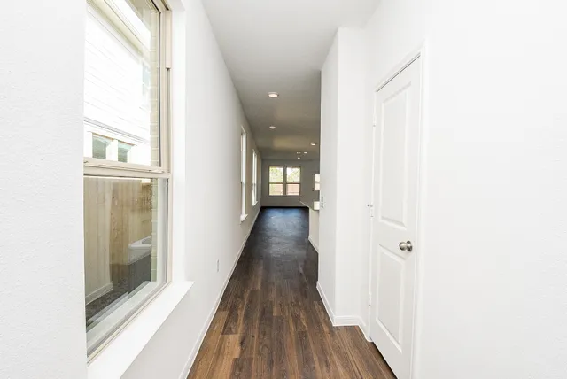 a kitchen with kitchen island granite countertop a stove a sink and a refrigerator