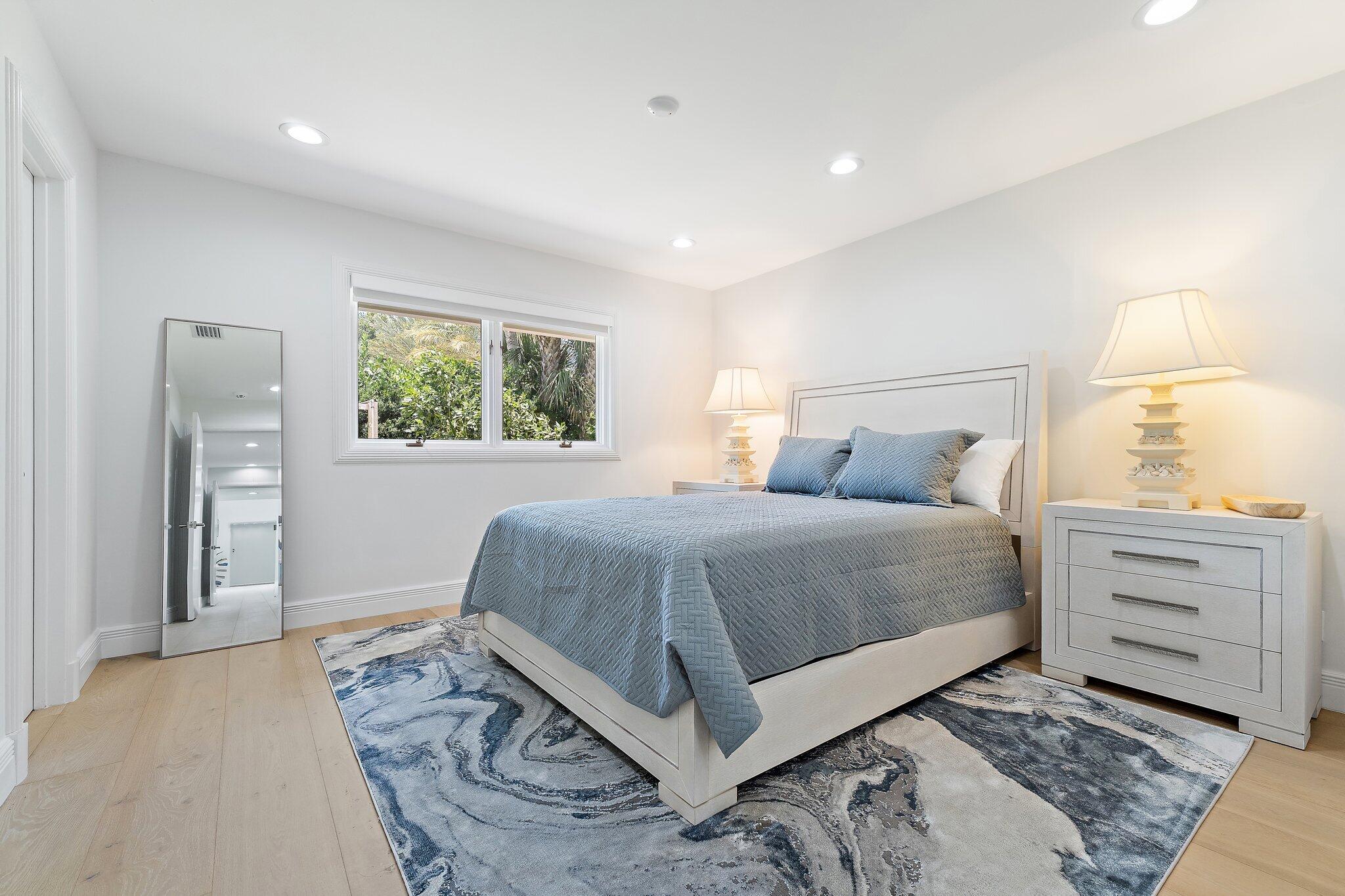 9 North River Road Stuart, FL 34996 - Photo 12 of 24 a bedroom with a bed and window