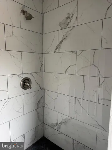 a view of a hallway with wooden floor and entryway