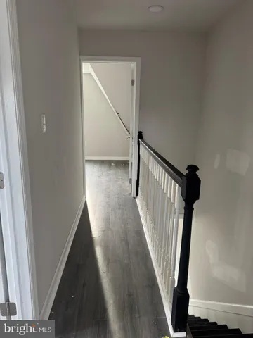 a bathroom with a toilet sink and window