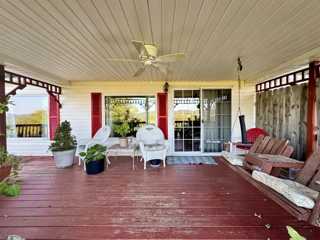 a living room filled with furniture and a chandelier