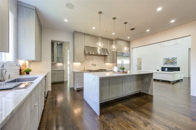 a kitchen with a stove and a sink