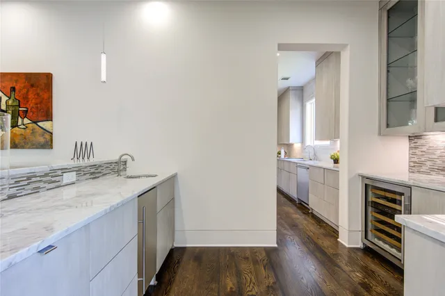 a kitchen with granite countertop a sink and a window