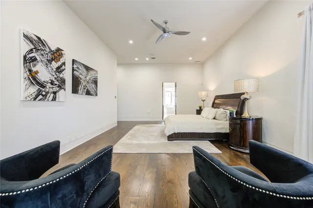 a living room with stainless steel appliances kitchen island granite countertop furniture and a large window