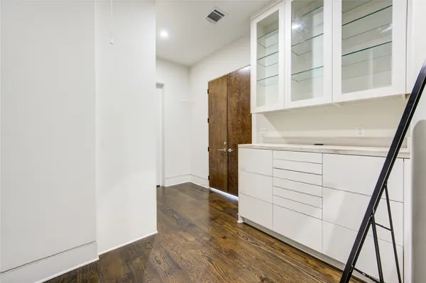 a living room with furniture a flat screen tv and a table