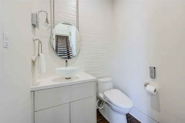 a front view of house with yard and trees