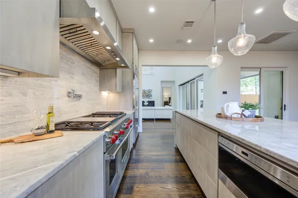 a kitchen with a stove and a sink