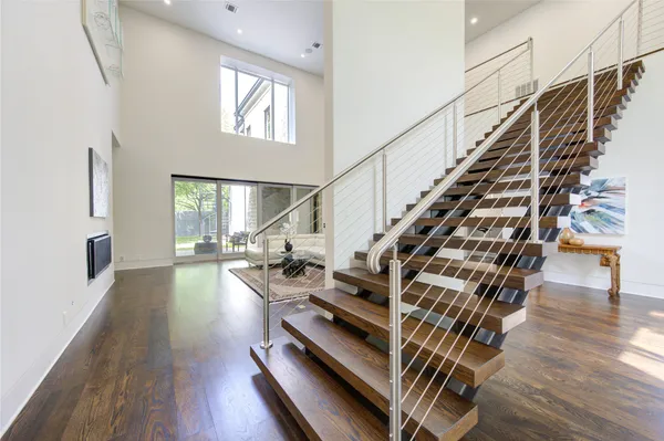a view of entryway and hall with wooden floor
