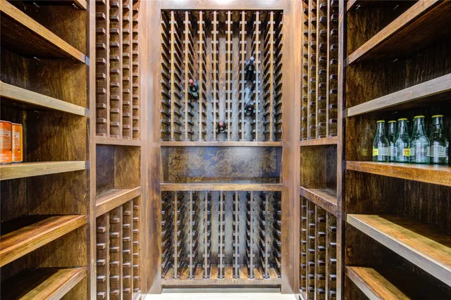 a kitchen with stainless steel appliances granite countertop a stove a sink and a wooden floors