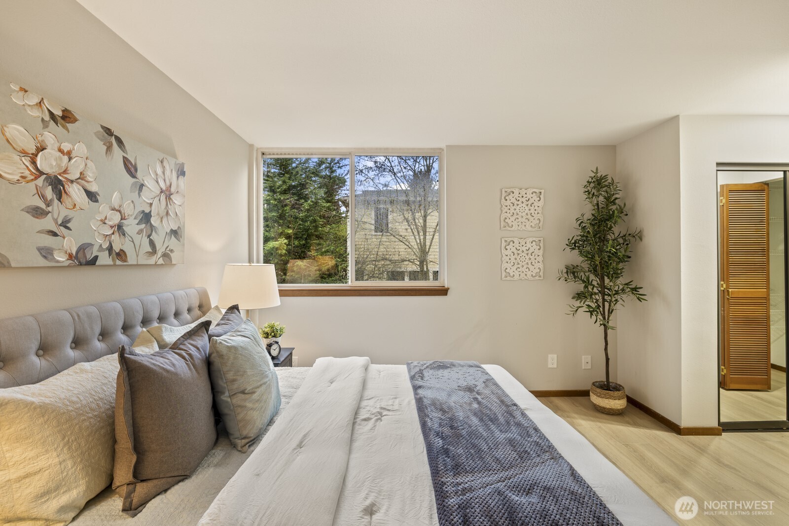 2350 10th Avenue East, Unit 227 Seattle, WA 98102 - Photo 16 of 34 a bed sitting in a bedroom next to a window