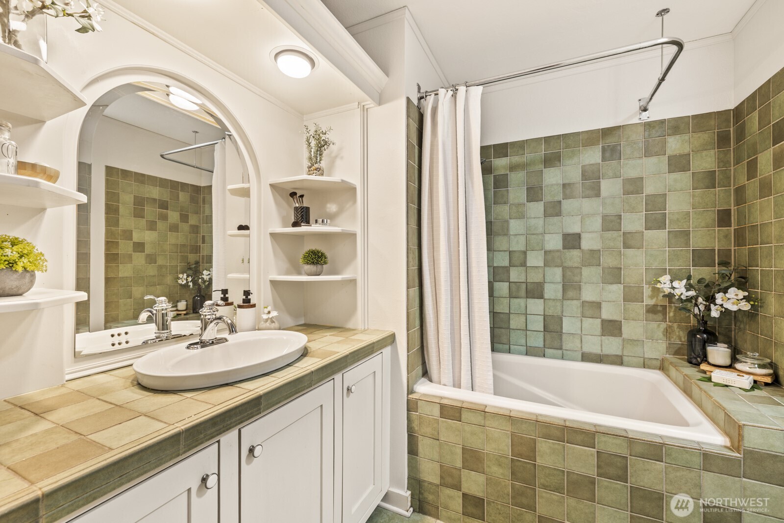 2350 10th Avenue East, Unit 227 Seattle, WA 98102 - Photo 18 of 34 a bathroom with a sink a tub and a mirror
