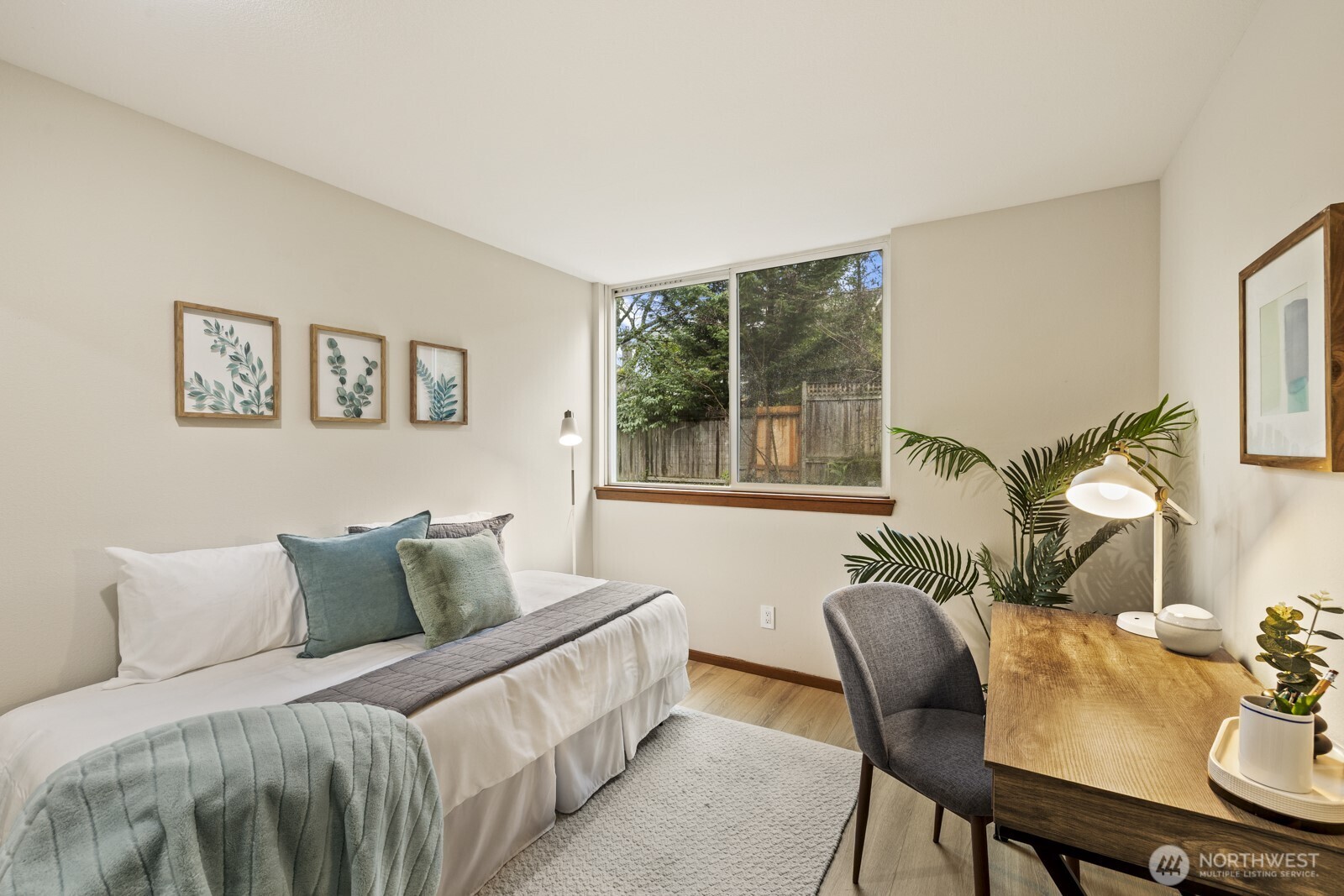 2350 10th Avenue East, Unit 227 Seattle, WA 98102 - Photo 24 of 34 a bedroom with a bed and wooden floor