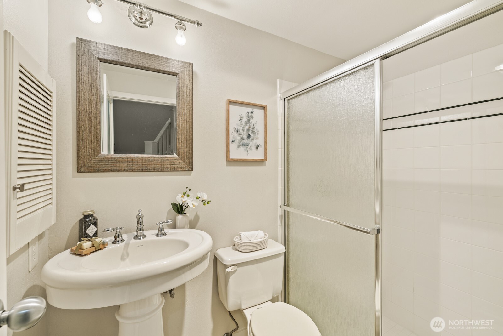 2350 10th Avenue East, Unit 227 Seattle, WA 98102 - Photo 26 of 34 a bathroom with a sink toilet and mirror