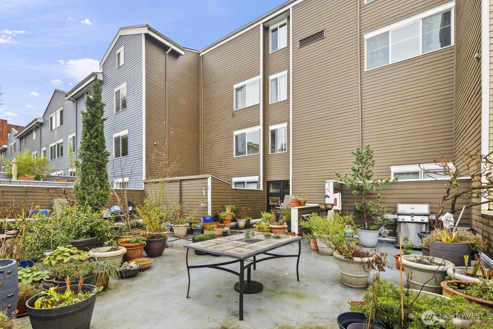 2350 10th Avenue East, Unit 227 Seattle, WA 98102 - Photo 28 of 34 a view of a patio with couches and potted plants