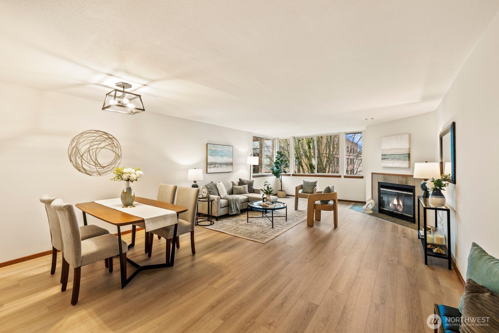 2350 10th Avenue East, Unit 227 Seattle, WA 98102 - Photo 3 of 34 a living room with furniture and a wooden floor