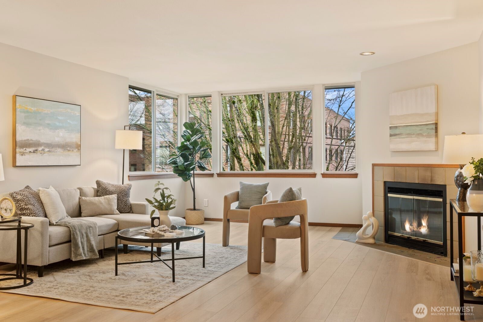 2350 10th Avenue East, Unit 227 Seattle, WA 98102 - Photo 4 of 34 a living room with furniture and a fireplace