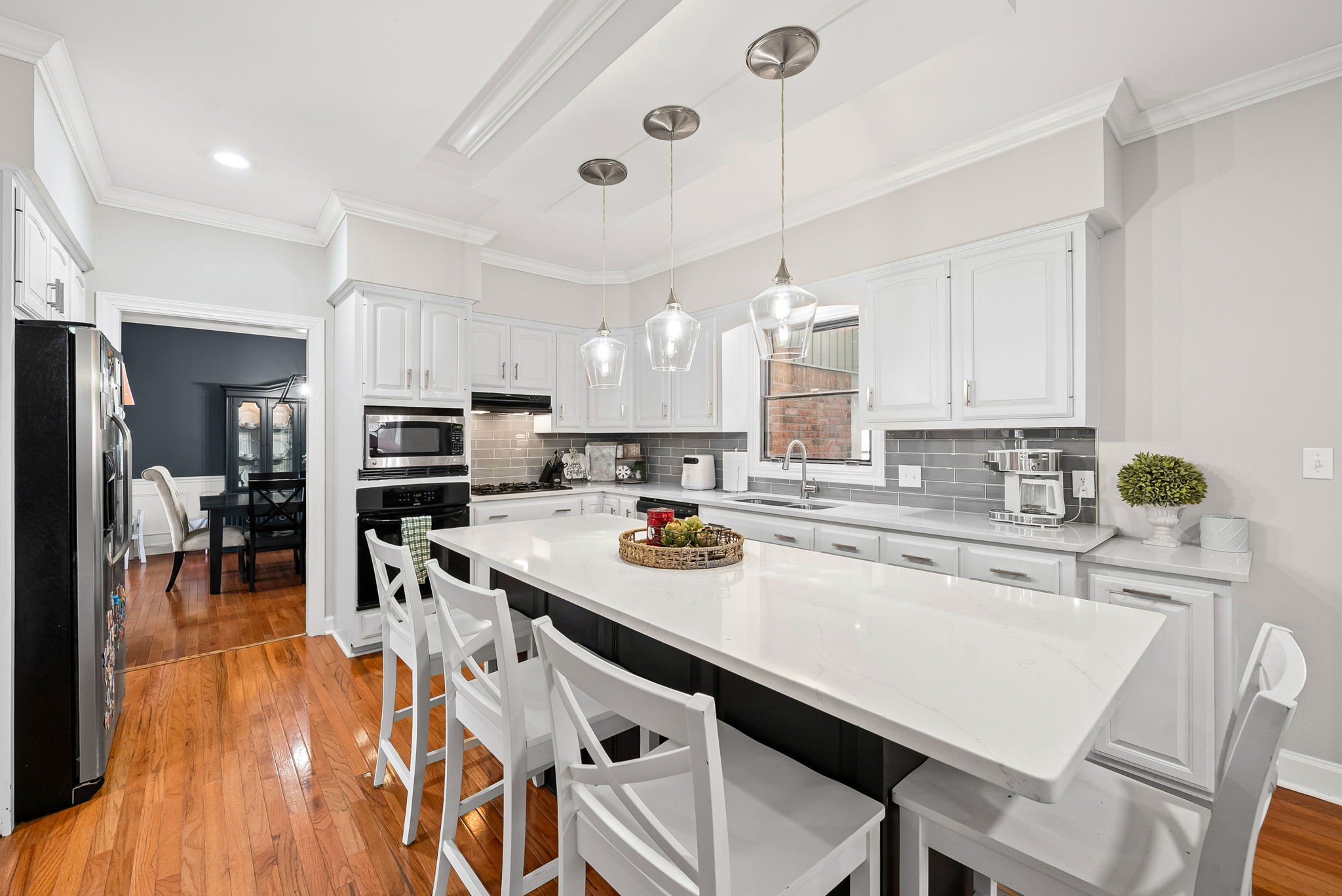 508 Sheffield Road Hopkinsville, KY 42240 - Photo 14 of 65 a kitchen with stainless steel appliances granite countertop a stove top oven a refrigerator a sink and chairs
