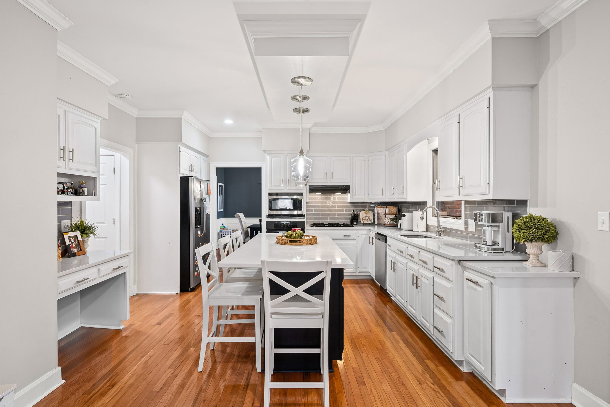 508 Sheffield Road Hopkinsville, KY 42240 - Photo 15 of 65 a kitchen with stainless steel appliances a dining table chairs sink and cabinets