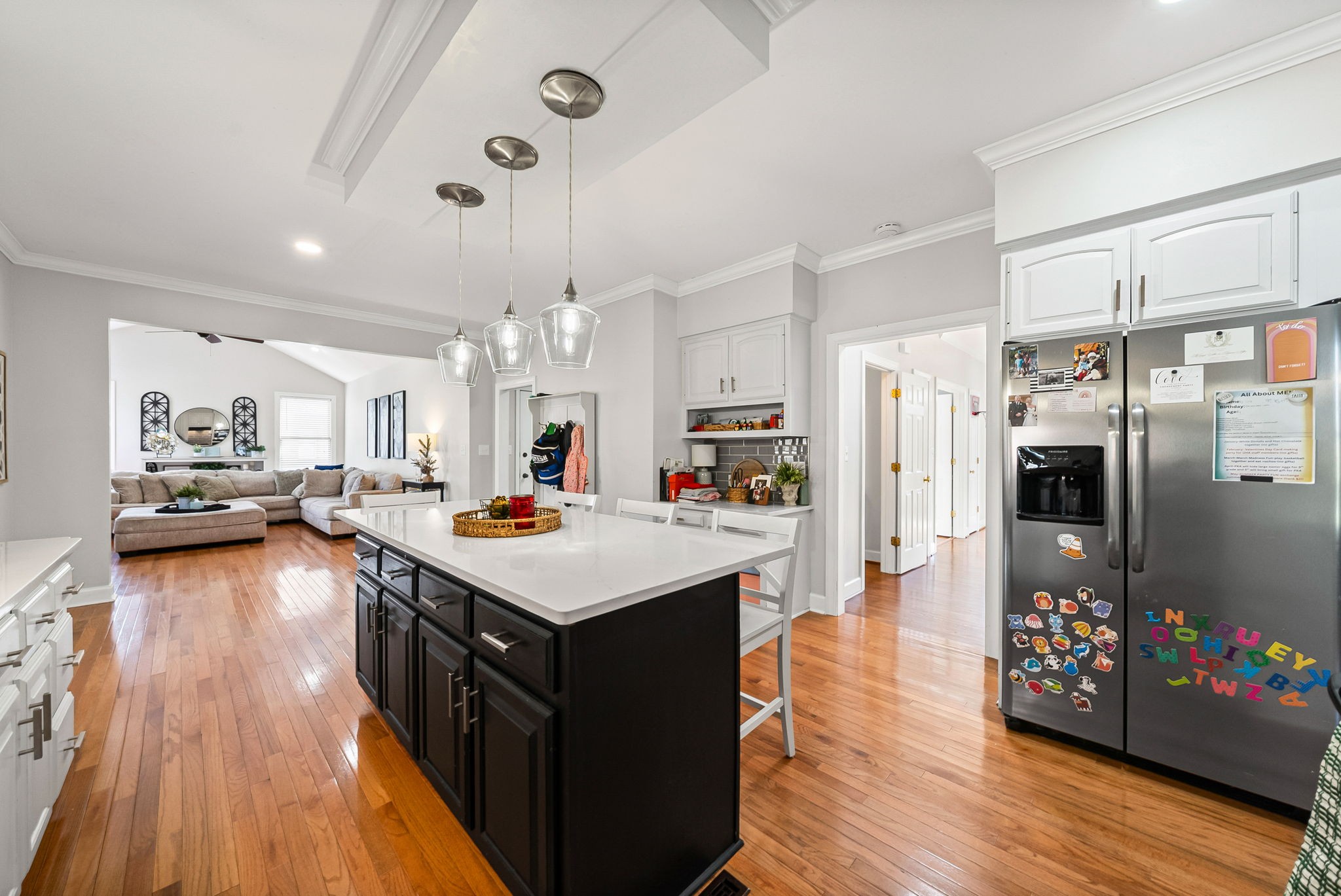 508 Sheffield Road Hopkinsville, KY 42240 - Photo 16 of 65 a kitchen with stainless steel appliances a stove a refrigerator a sink dishwasher and a dining table with wooden floor