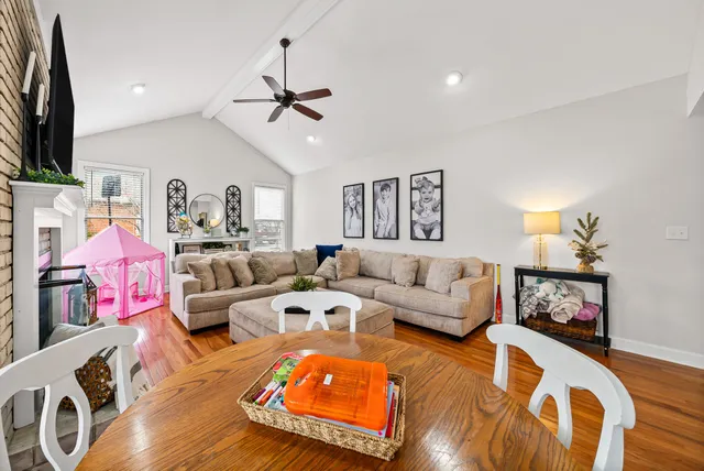 a bedroom with furniture and wooden floor