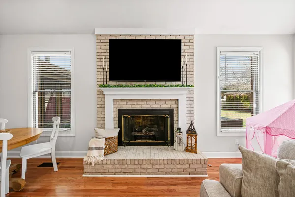 a view of a livingroom with furniture and a flat screen tv