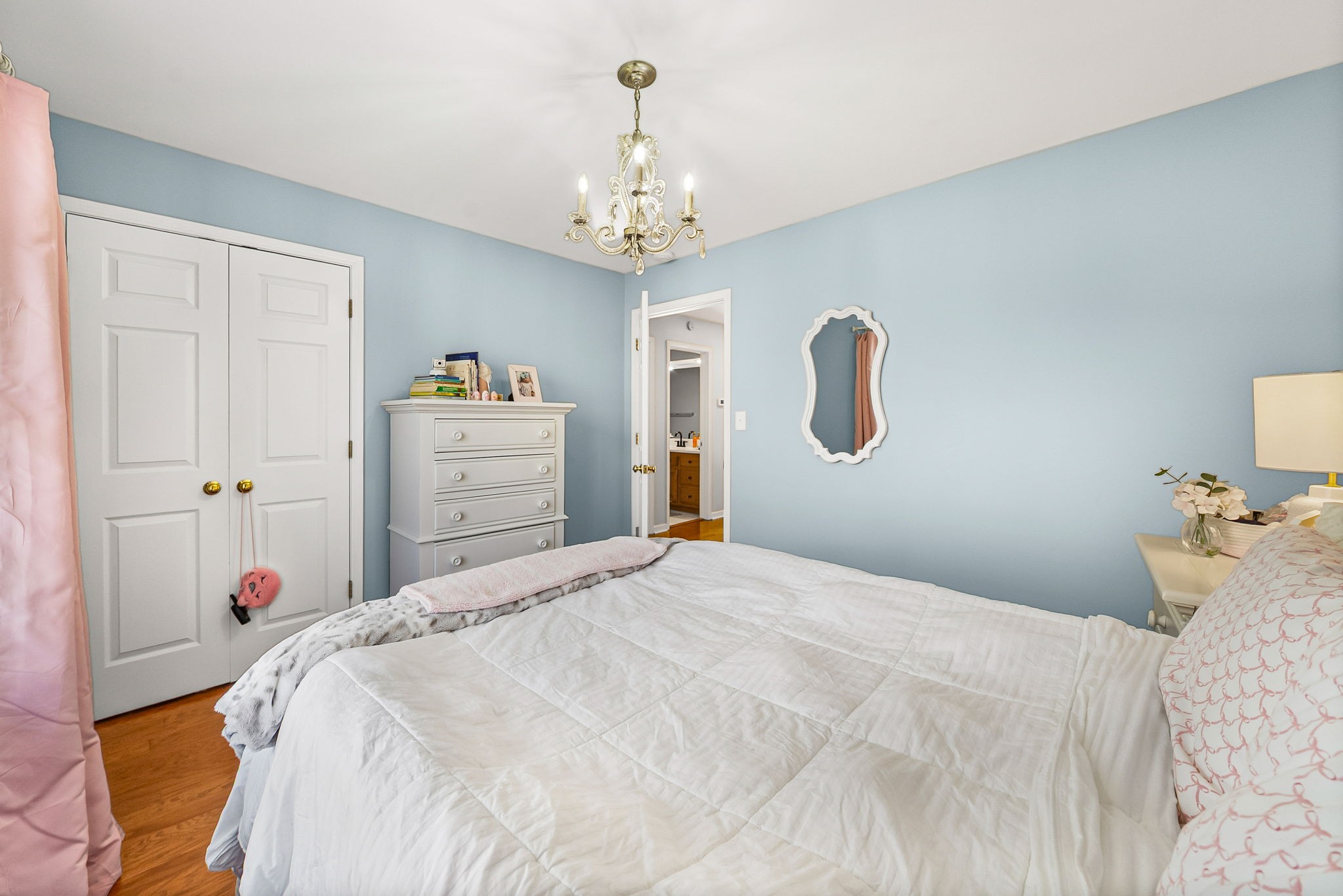 508 Sheffield Road Hopkinsville, KY 42240 - Photo 39 of 65 a bedroom with a bed and a chandelier