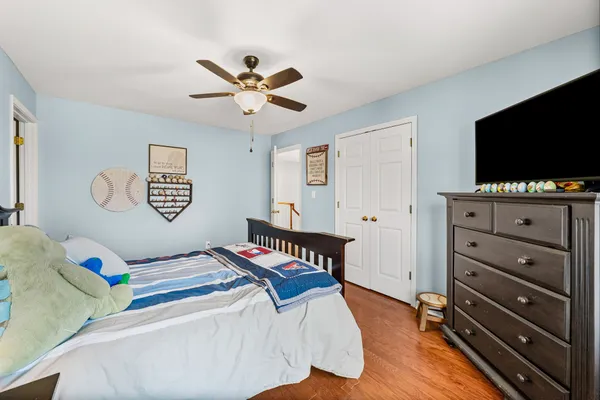 a bed room with a bed and a chandelier