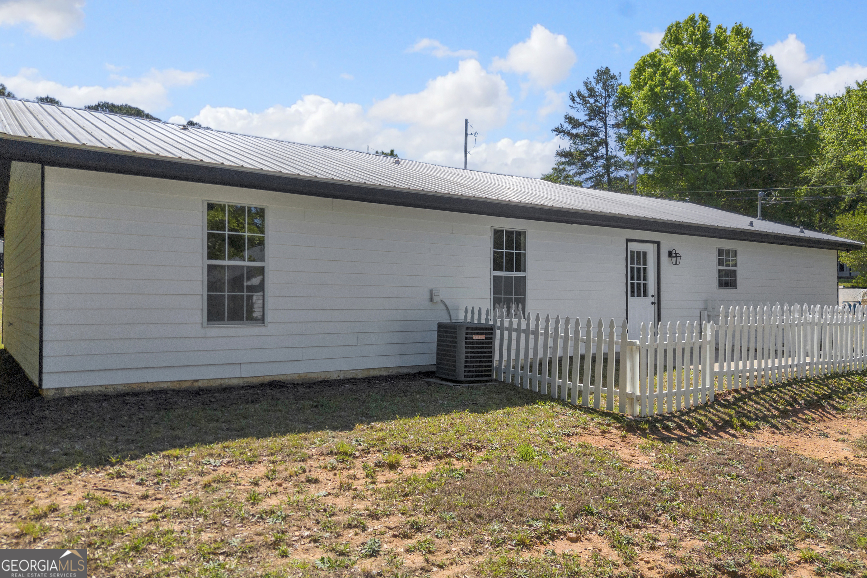 248 Highland Estates Commerce, GA 30529 - Photo 14 of 57 a side view of a house with a backyard
