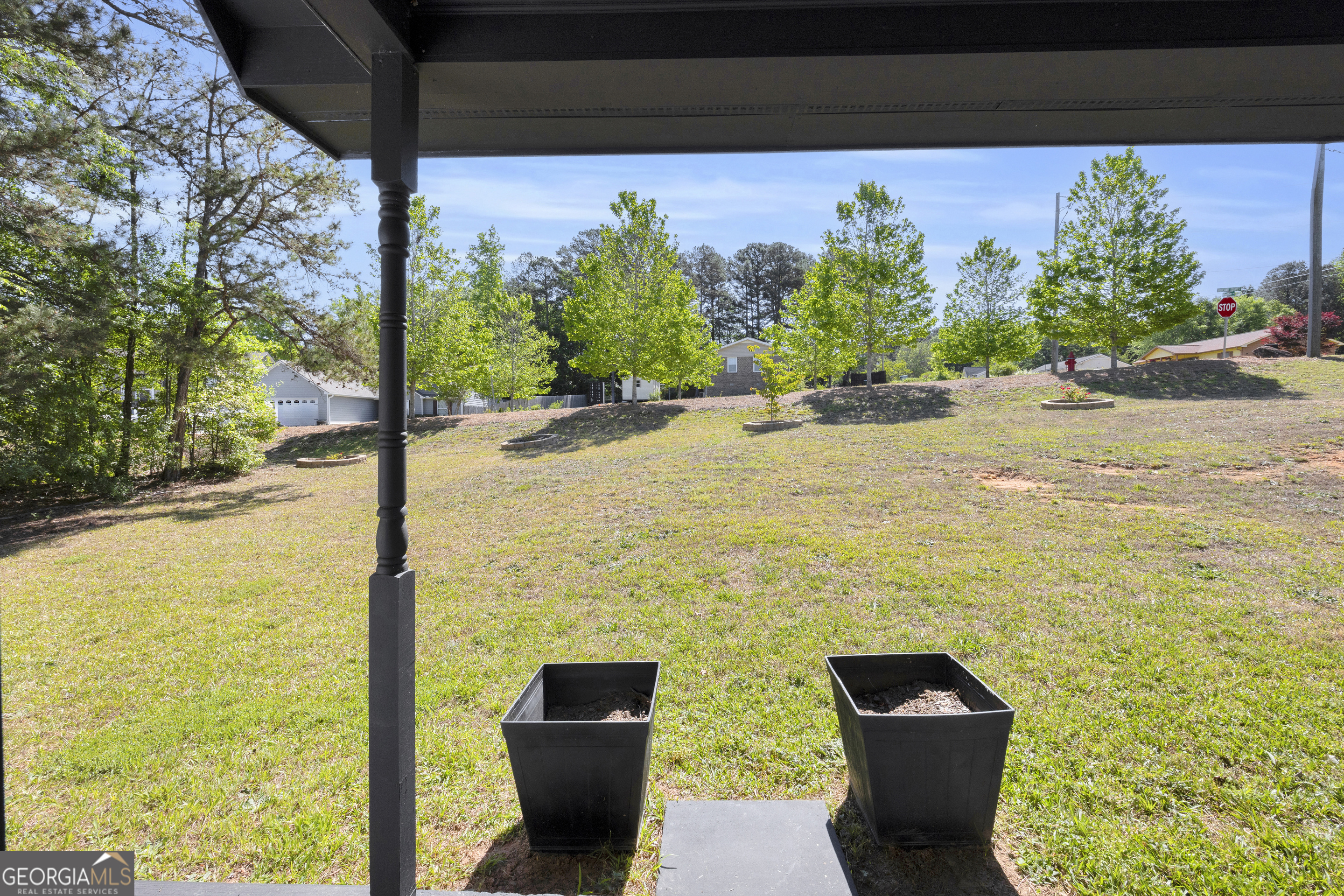 248 Highland Estates Commerce, GA 30529 - Photo 15 of 57 a view of a backyard of the house with a bench