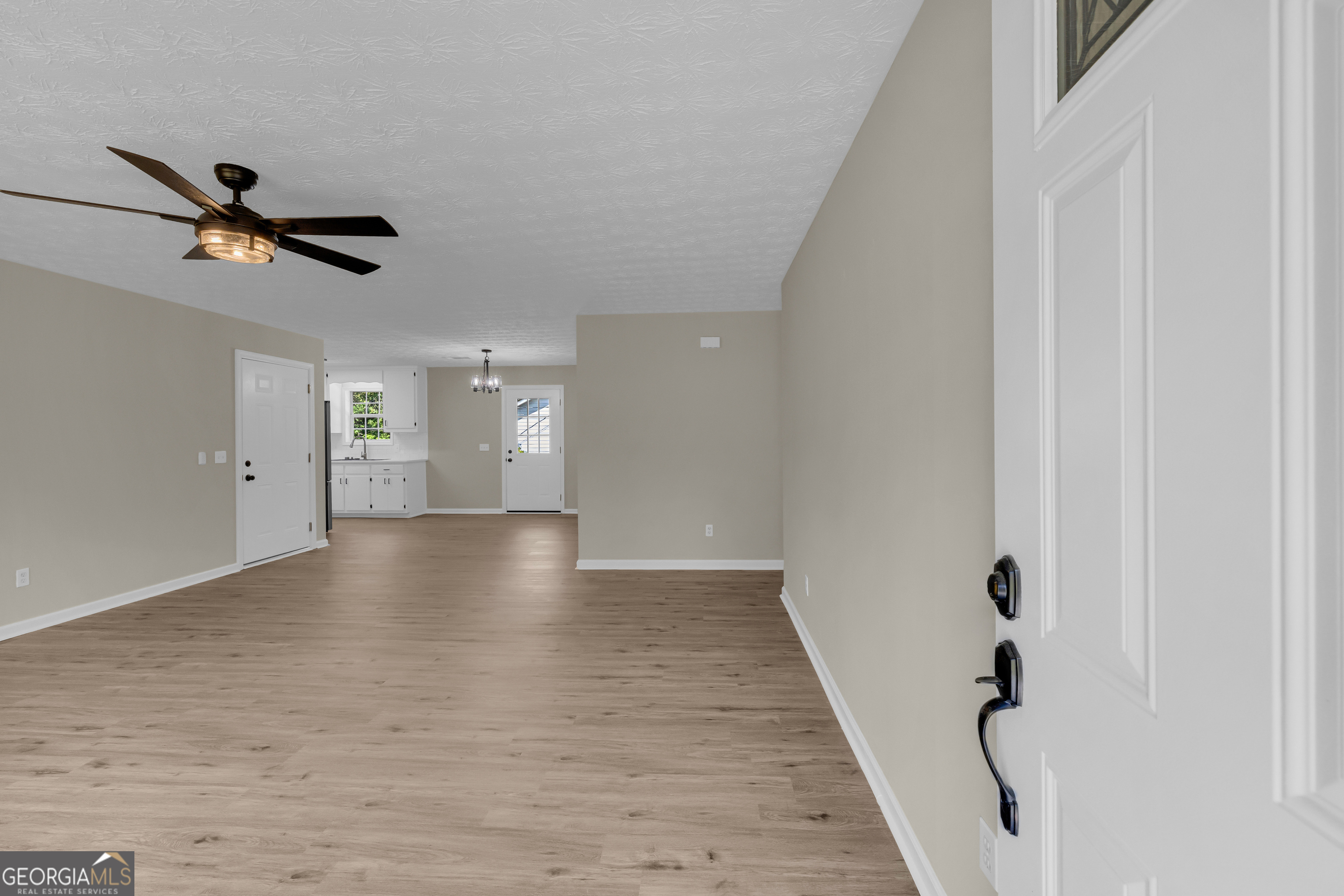 248 Highland Estates Commerce, GA 30529 - Photo 16 of 57 a view of empty room with wooden floor