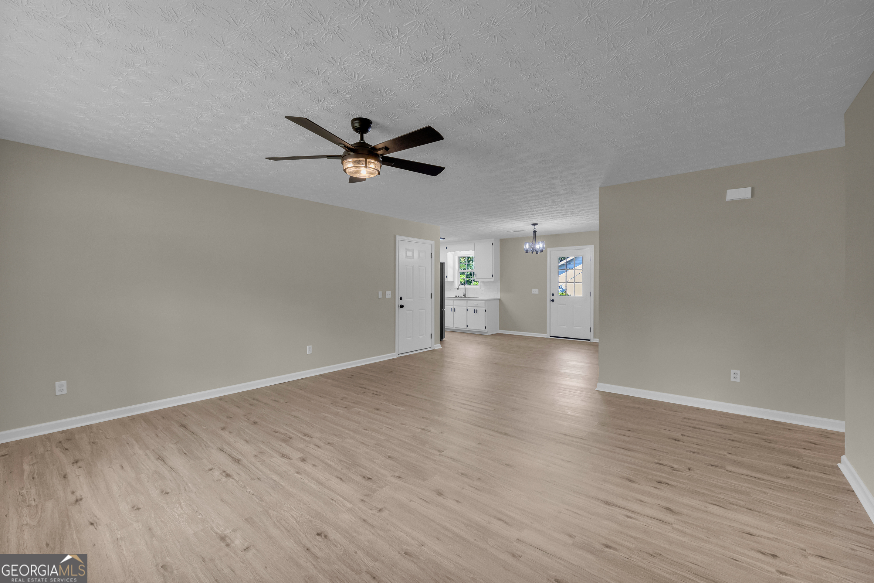 248 Highland Estates Commerce, GA 30529 - Photo 18 of 57 a view of an empty room with a window and wooden floor