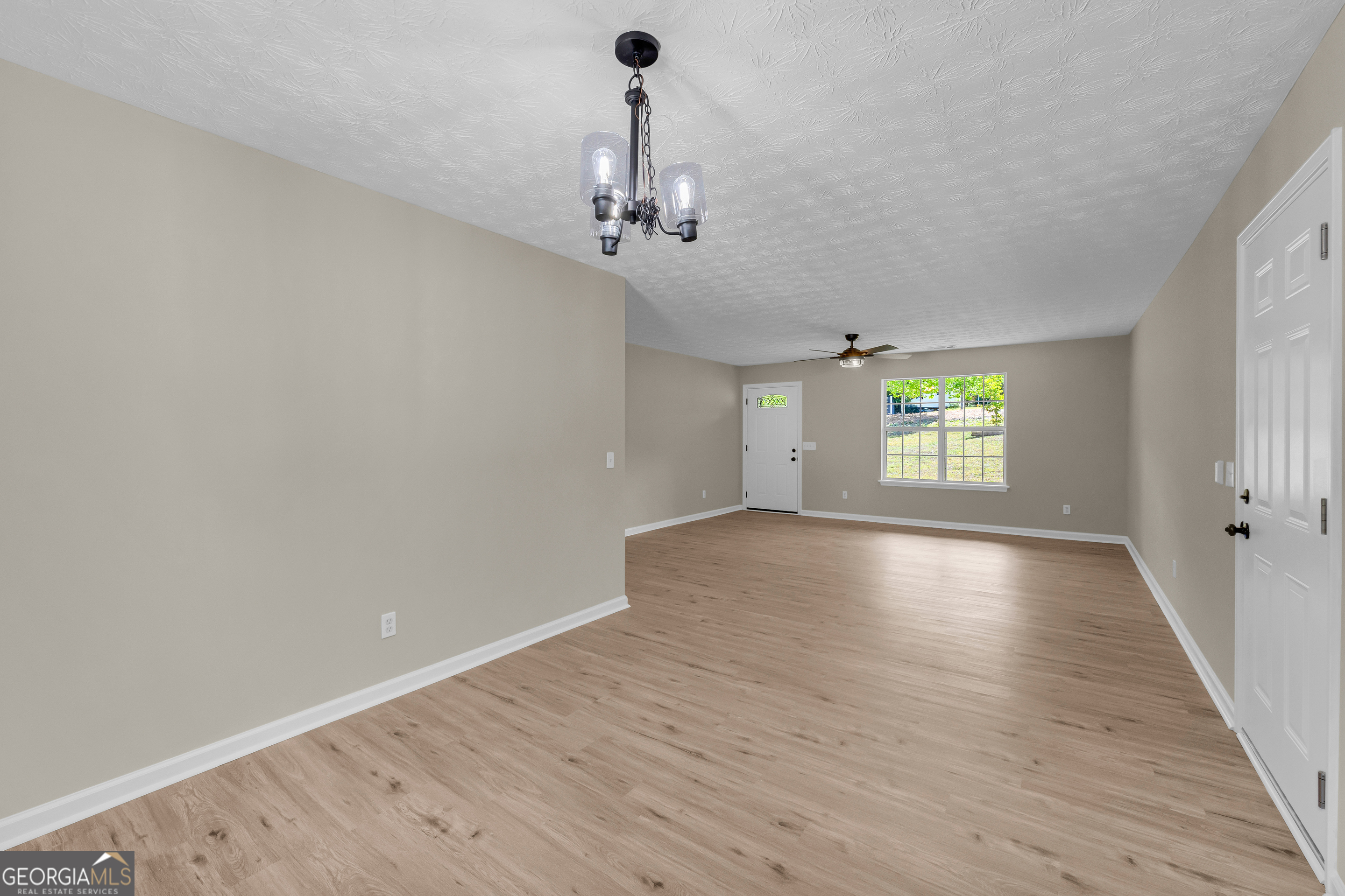 248 Highland Estates Commerce, GA 30529 - Photo 23 of 57 wooden floor in an empty room with a window