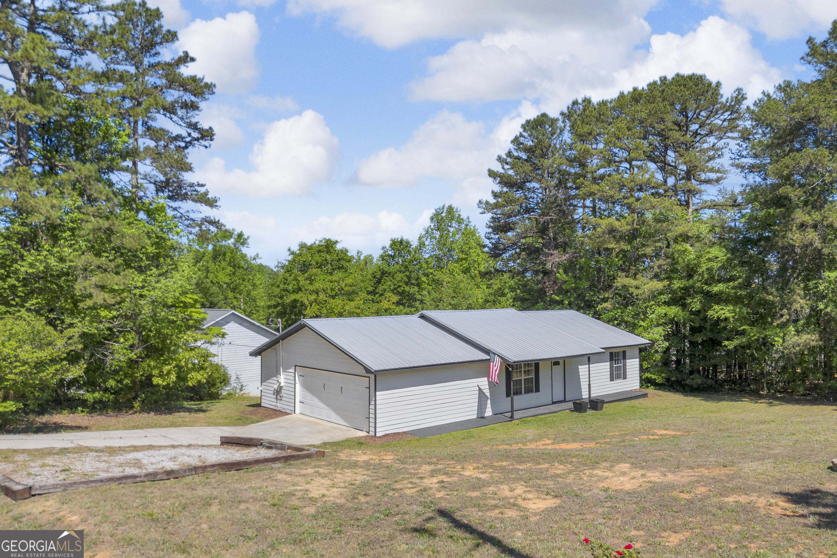 248 Highland Estates Commerce, GA 30529 - Photo 3 of 57 a house with trees in the background