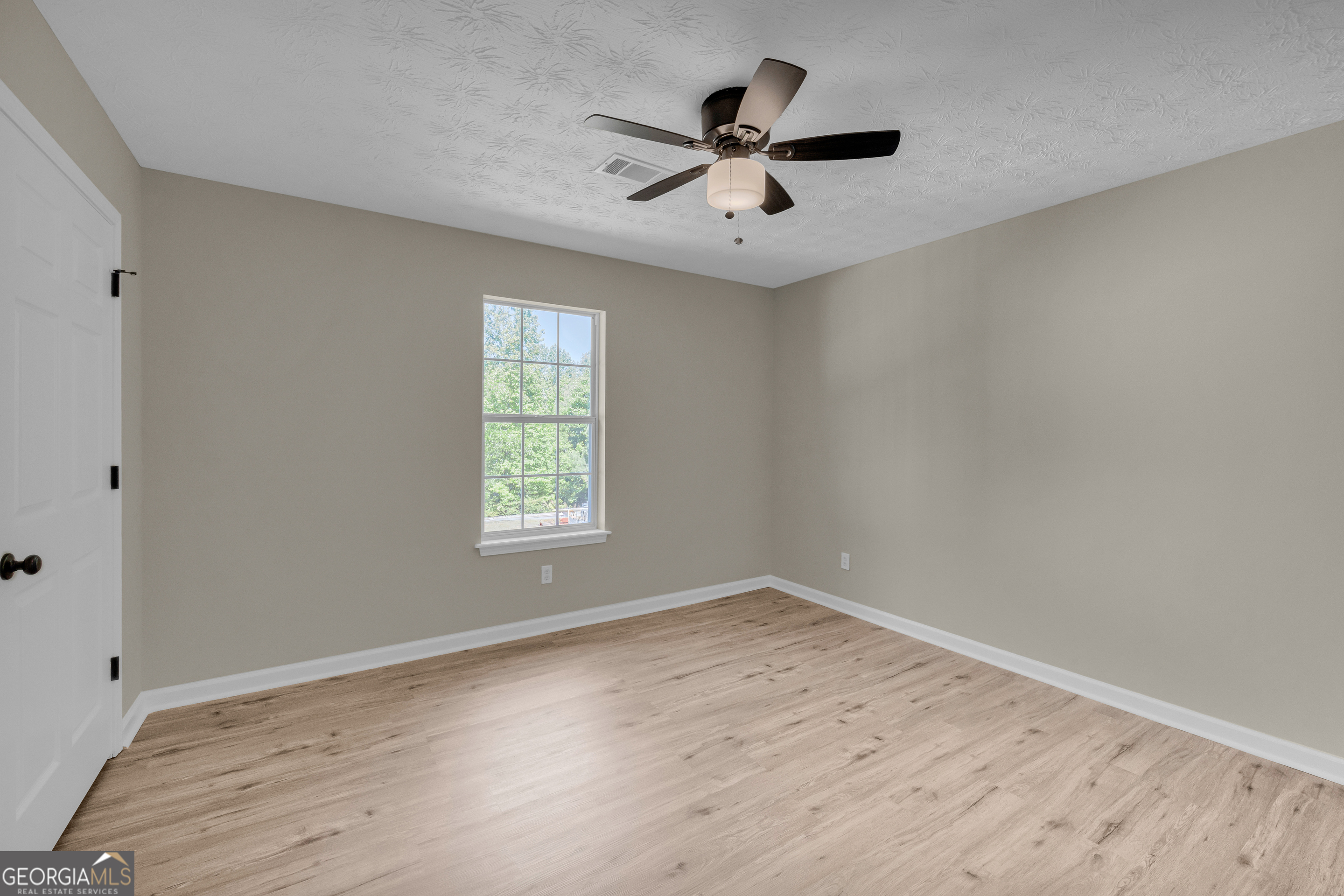 248 Highland Estates Commerce, GA 30529 - Photo 34 of 57 wooden floor in an empty room with a window