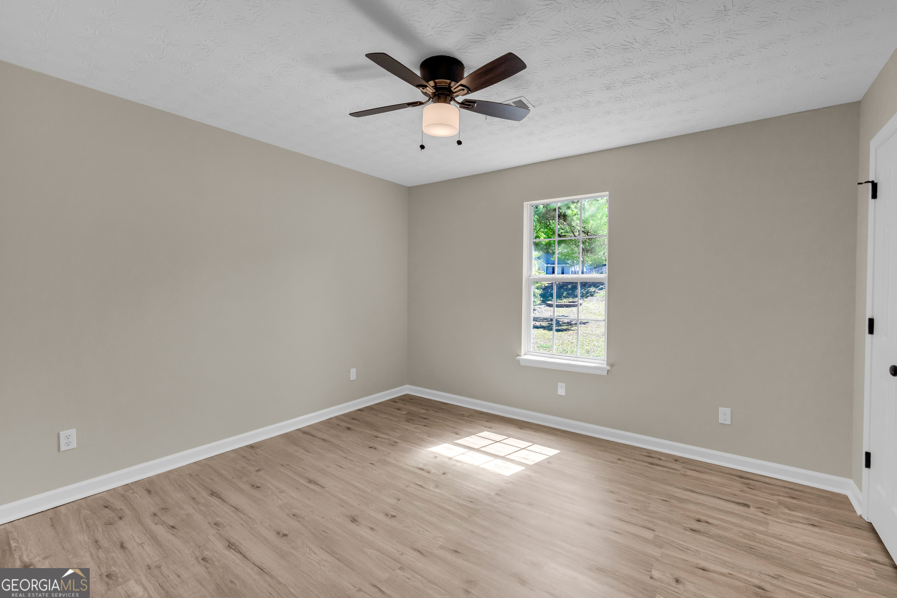 248 Highland Estates Commerce, GA 30529 - Photo 36 of 57 wooden floor in an empty room with a window