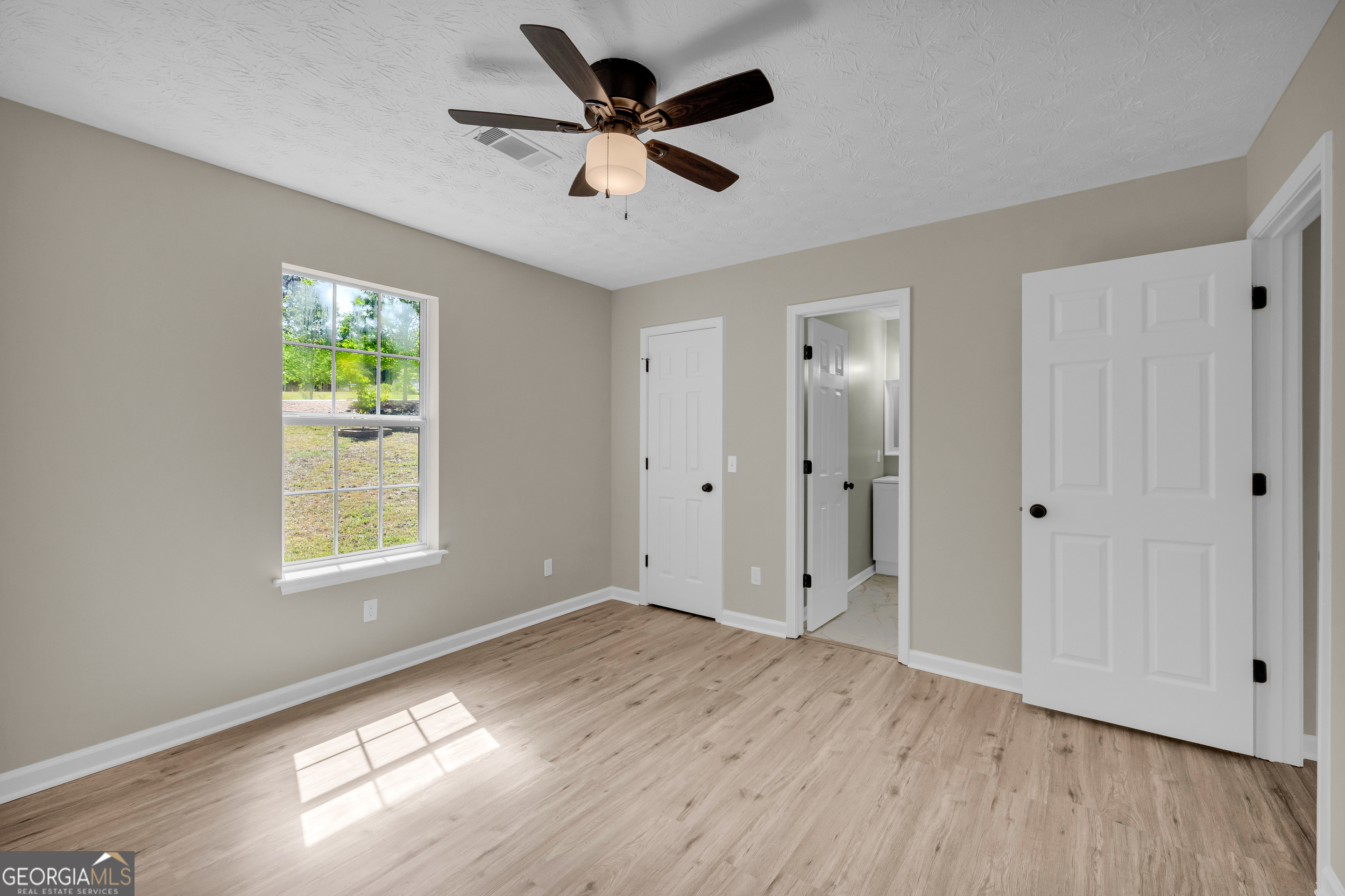 248 Highland Estates Commerce, GA 30529 - Photo 39 of 57 wooden floor in an empty room with a window