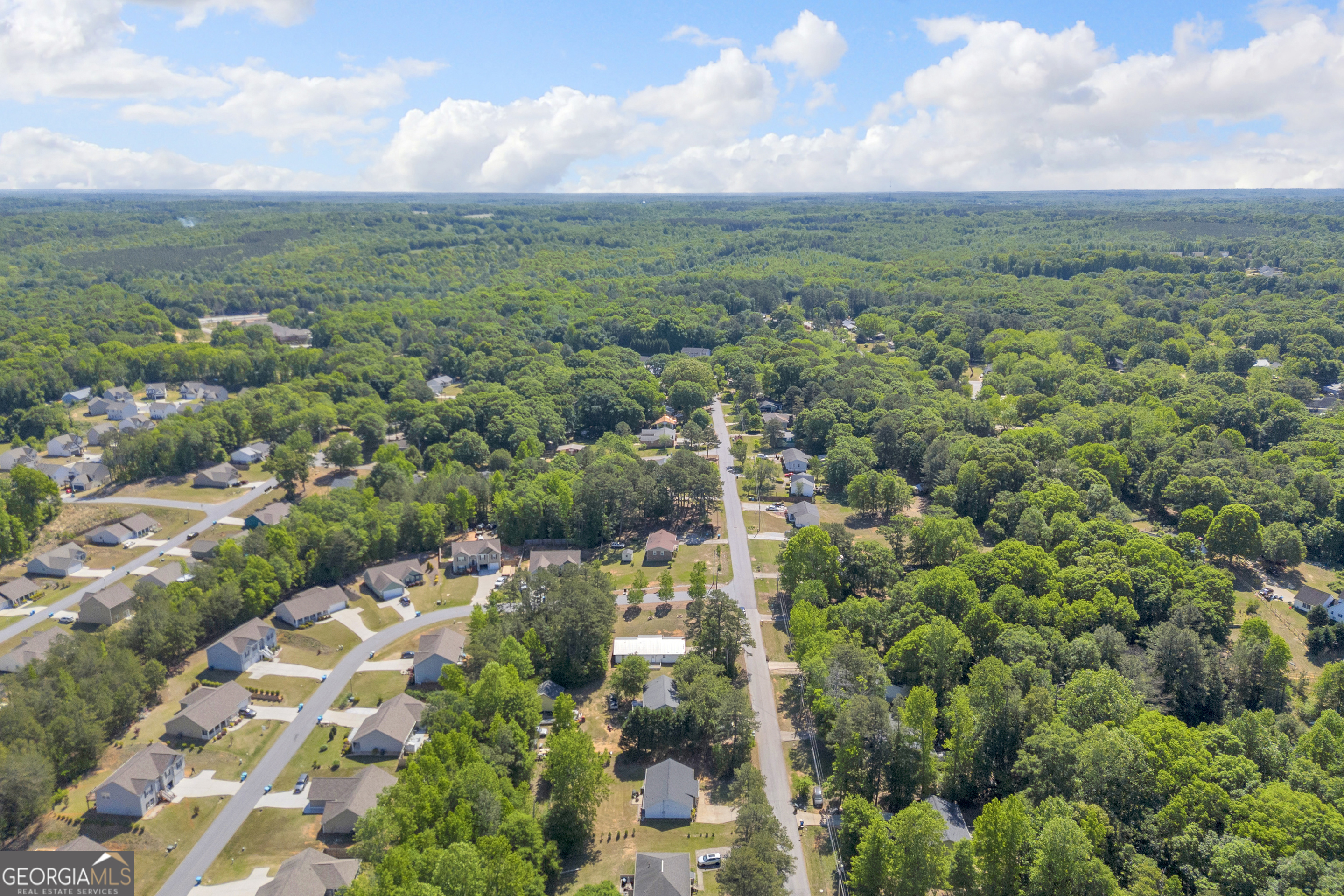 248 Highland Estates Commerce, GA 30529 - Photo 49 of 57 a view of a city with lush green forest