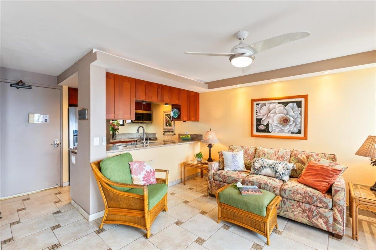 191 North Kihei Road, Unit 402 Kihei, HI 96753 - Photo 14 of 48 a living room with furniture and a large window