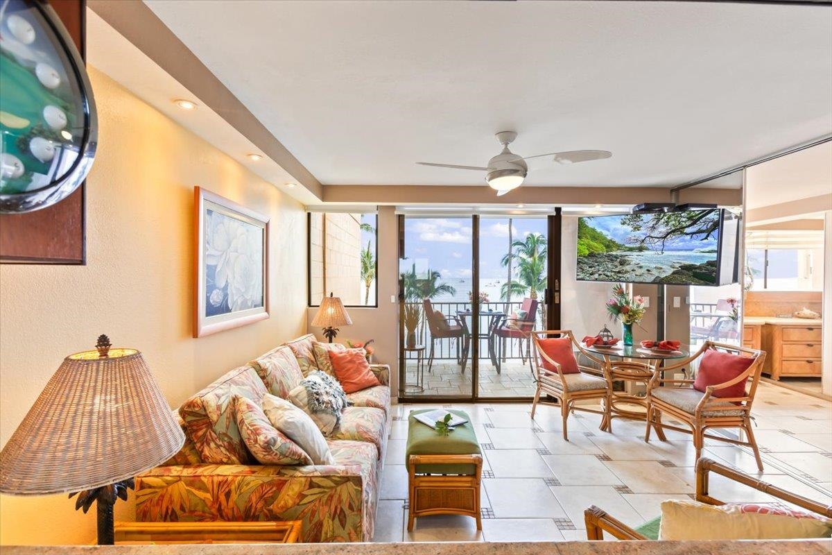 191 North Kihei Road, Unit 402 Kihei, HI 96753 - Photo 17 of 48 a living room with furniture and a large window