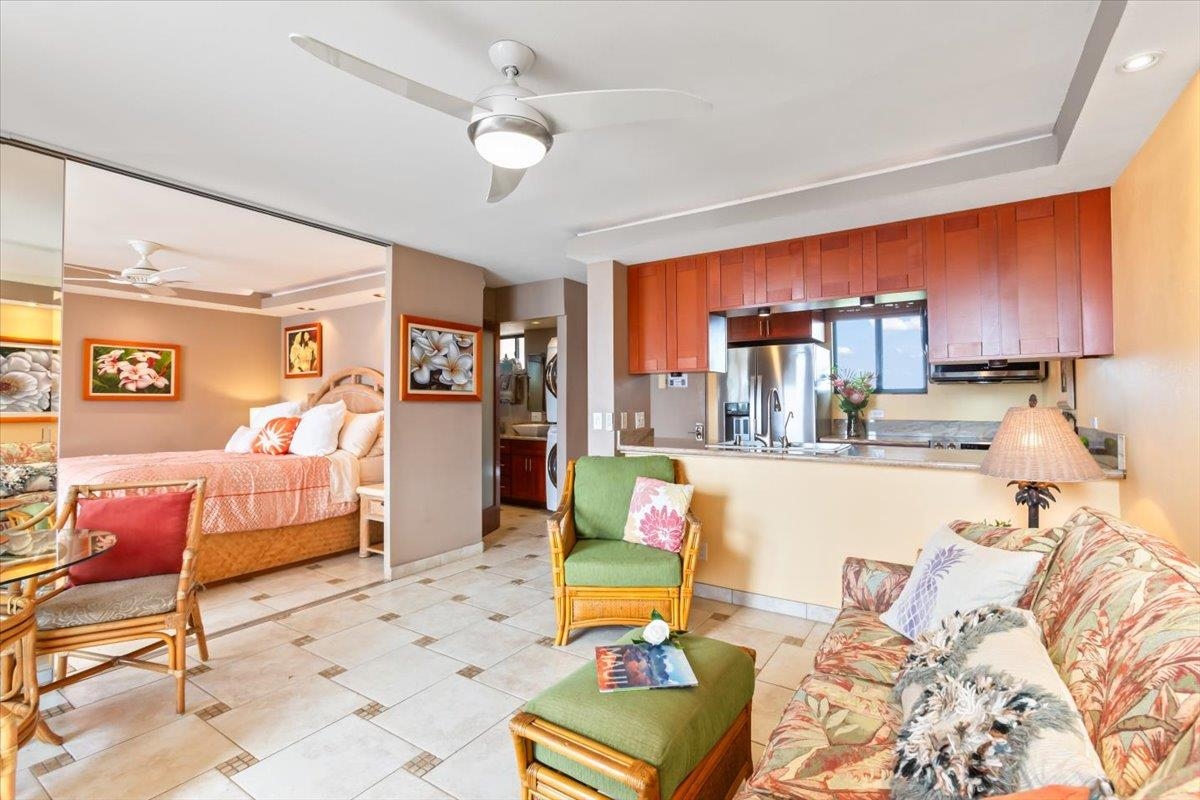 191 North Kihei Road, Unit 402 Kihei, HI 96753 - Photo 19 of 48 a living room with furniture and a flat screen tv