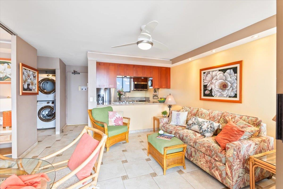 191 North Kihei Road, Unit 402 Kihei, HI 96753 - Photo 20 of 48 a living room with furniture and a flat screen tv