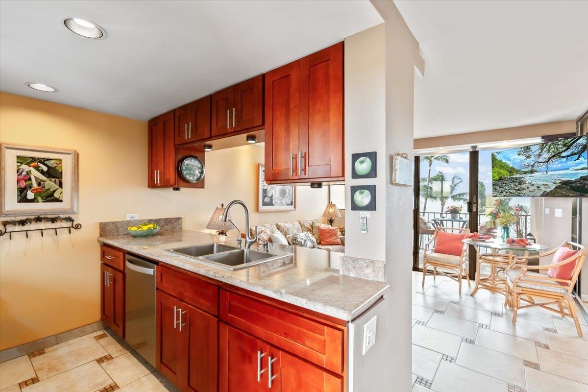 191 North Kihei Road, Unit 402 Kihei, HI 96753 - Photo 2 of 48 a kitchen with a sink and a refrigerator